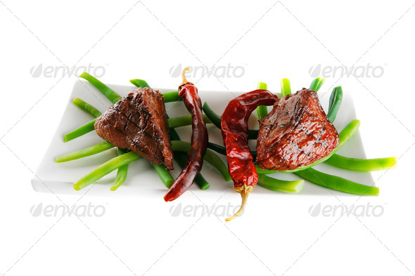 roast veal fillet on a plate with peppers (Misc) Photo Download