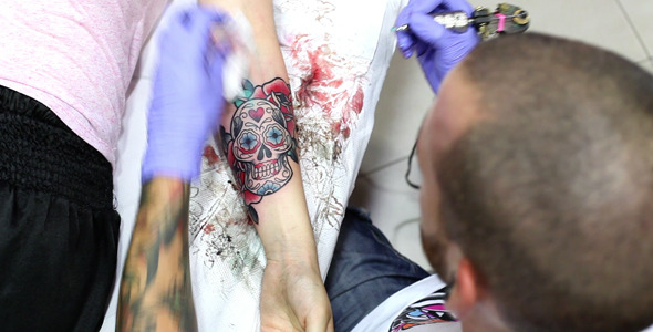 Artist Working On A Tattoo Artist Working On A Tattoo