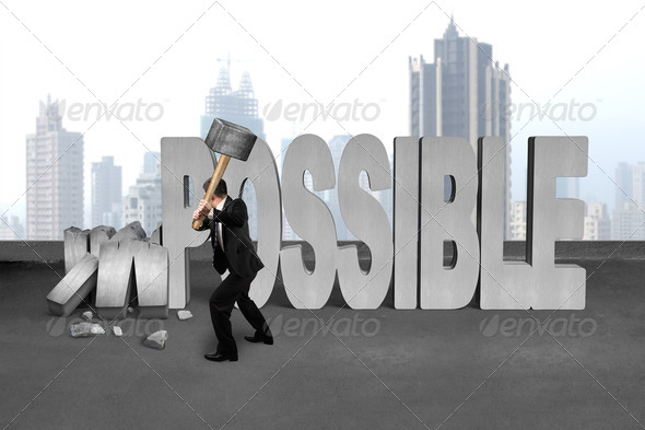 businessman hold sledgehammer to smash impossible 3D concrete word (Misc) Photo Download