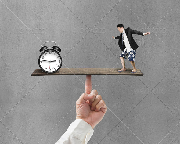 man standing on finger seesaw vs clock (Misc) Photo Download