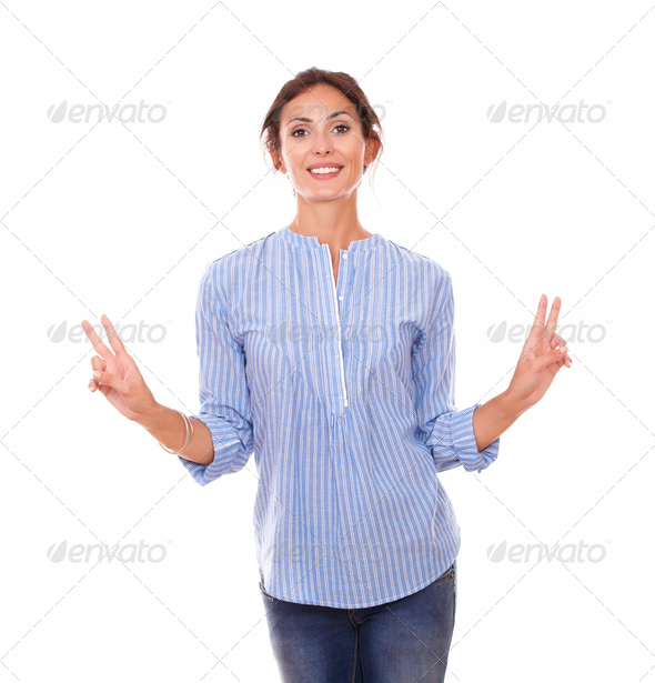 Attractive woman with victory sign and smiling (Misc) Photo Download