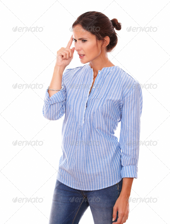 Frustrated latin woman wondering while standing (Misc) Photo Download