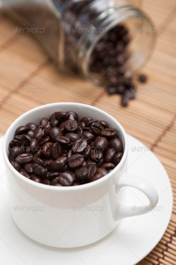 Roasted coffee beans in glass and bottle. (Misc) Photo Download