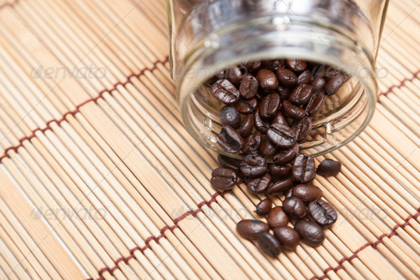 Coffee beans spilled from bottle (Misc) Photo Download