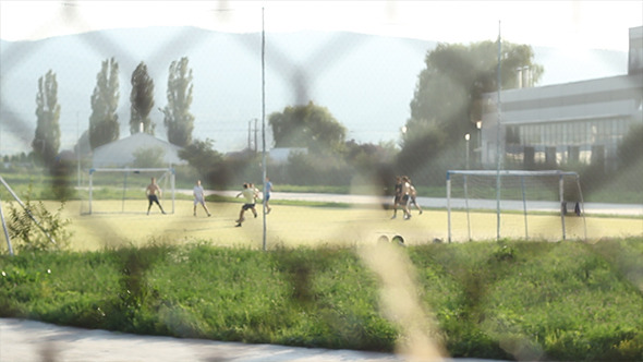 Kids Playing Football after Fence Kids Playing Football after Fence