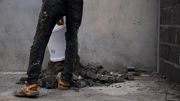 Worker Throwing Construction Waste Worker Throwing Construction Waste