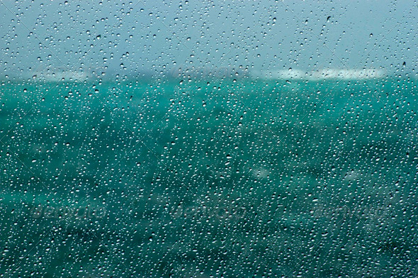 boat window with water drops in focus