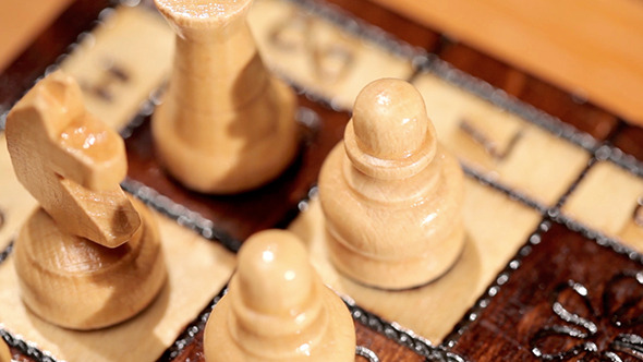 Close Up Chess Pieces On A Board Close Up Chess Pieces On A Board