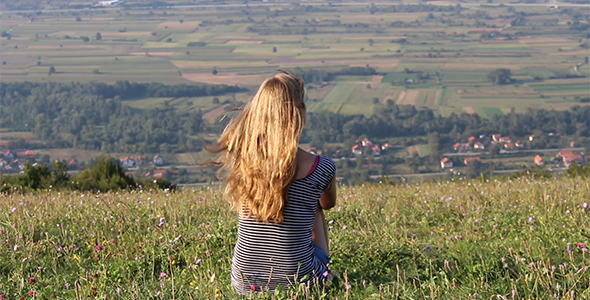 Girl Sitting on Top of the Hill Looking Far Away 2 Girl Sitting on Top of the Hill Looking Far Away 2