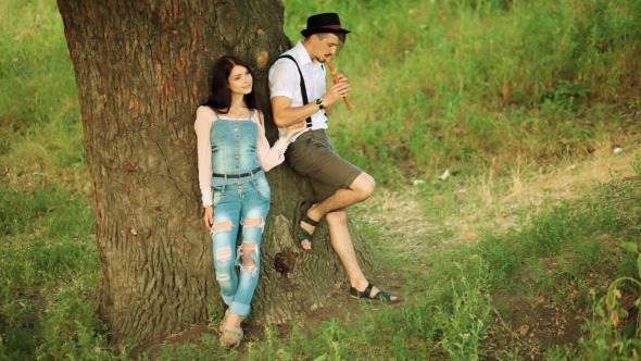 He Playing Flute And Harmonica She Listens Him He Playing Flute And Harmonica She Listens Him