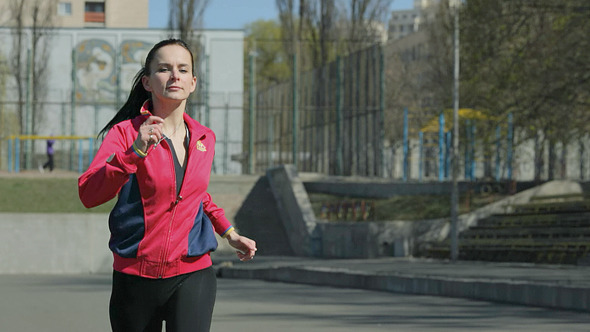 A Young Girl Trains to Run On The Treadmill A Young Girl Trains to Run On The Treadmill