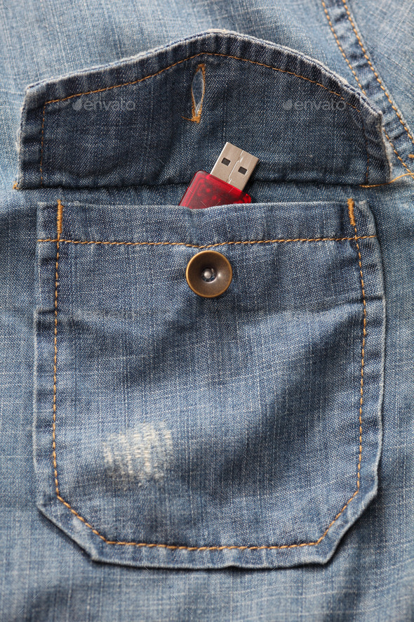 USB flash drive in the denim shirt pocket