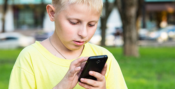 Boy Play on Smatphone Boy Play on Smatphone