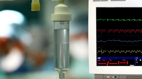 Surgeons With ECG Monitor Surgeons With ECG Monitor