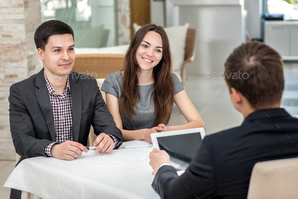 A great deal! Three young businessman sitting at a table in the