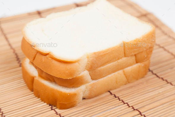 Sliced ??bread on the wooden plate. (Misc) Photo Download