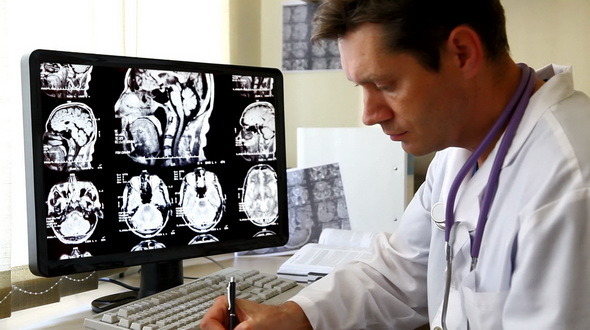 Doctor Looking At CT Scan Doctor Looking At CT Scan