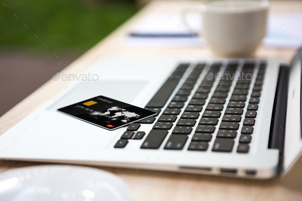Close up of credit card on laptop computer keyboard