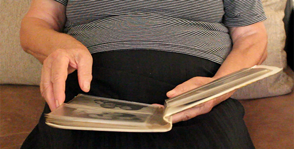 Grandmother Browsing Old Photo Album Grandmother Browsing Old Photo Album