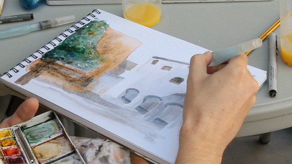 Pencil of sketcher paint in a book Pencil of sketcher paint in a book