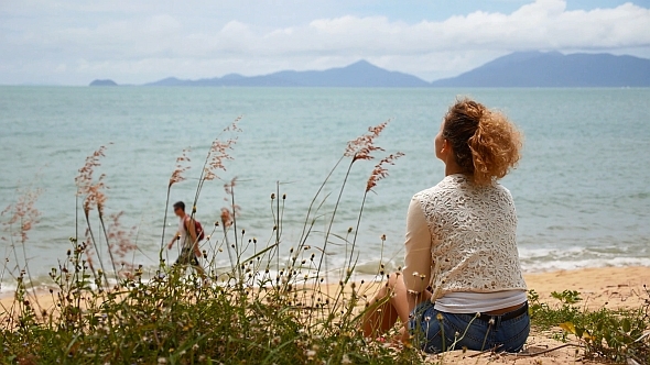 Female Relaxing at Beach Female Relaxing at Beach