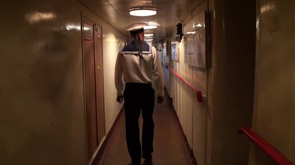 Sailor Passes Through the Ship Corridor Sailor Passes Through the Ship Corridor