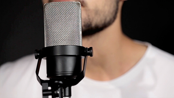 Men Singing At Microphone Men Singing At Microphone