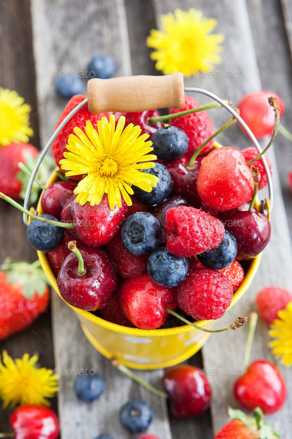 Fresh cherry, strawberry, blueberry and raspberry in a bucket (Misc) Photo Download