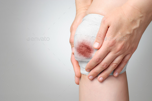 Injured knee with bloody bandage (Misc) Photo Download