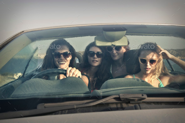 Four girls in a car going on vacation (Misc) Photo Download