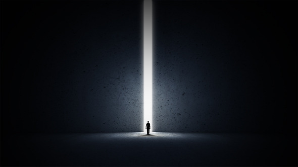 A Person Walking Through A Narrow Passage A Person Walking Through A Narrow Passage