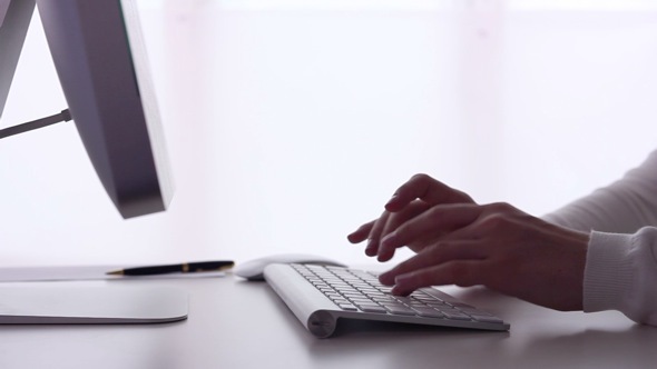Business Woman Typing on a Computer Business Woman Typing on a Computer