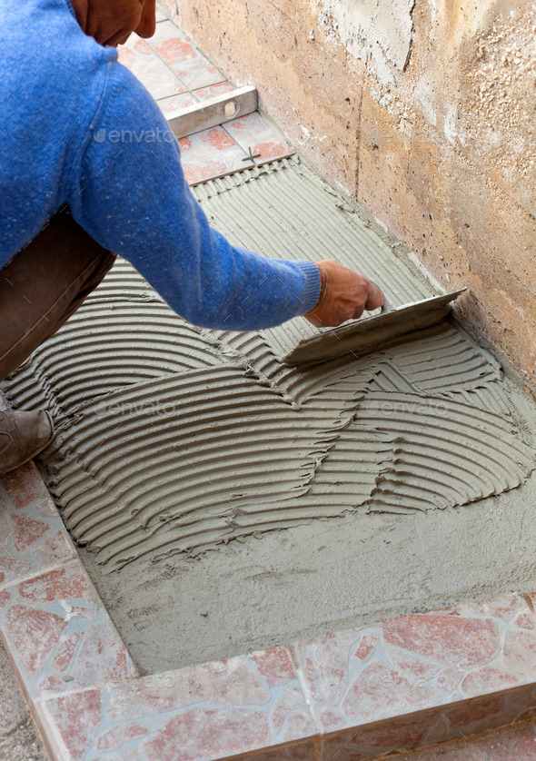 Tiler works with flooring.