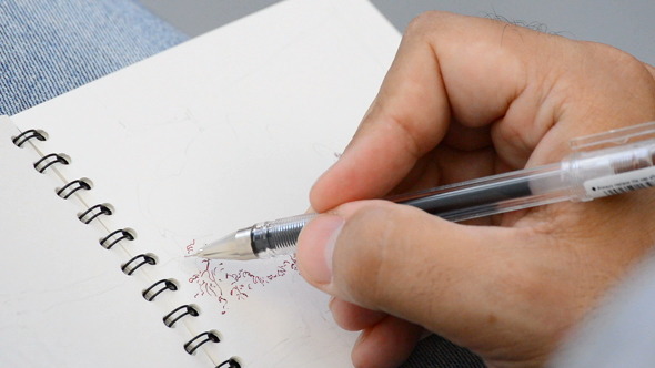 Pencil of Sketcher Painting in a Book Pencil of Sketcher Painting in a Book