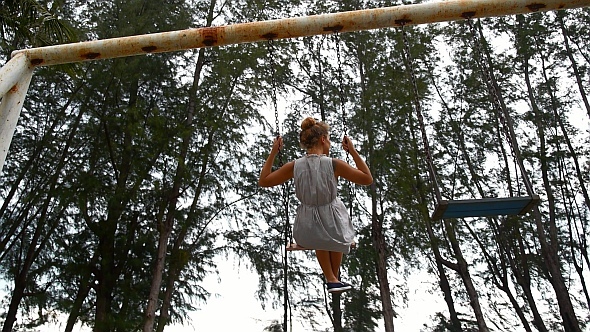 Girl on Swing in Slow Motion Girl on Swing in Slow Motion