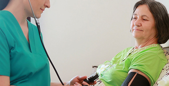 Nurse Checking Blood Pressure to Senior Woman 2 Nurse Checking Blood Pressure to Senior Woman 2