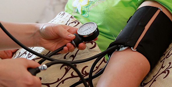 Blood Pressure Check to Senior Woman Blood Pressure Check to Senior Woman