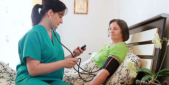 Nurse Checking Blood Pressure to Senior Woman Nurse Checking Blood Pressure to Senior Woman