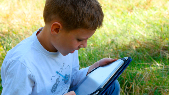 Happy Young Boy Using Tablet 2 Happy Young Boy Using Tablet 2