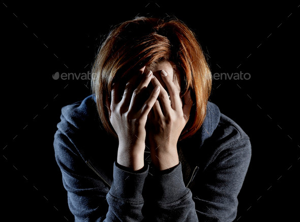 close up woman suffering depression and stress alone in pain and grief (Misc) Photo Download