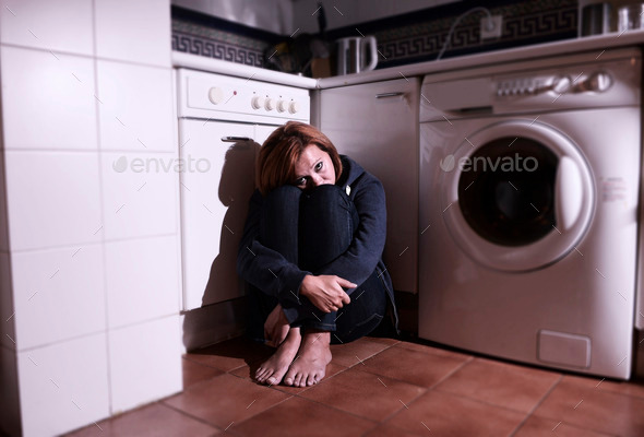 lonely scared and sick woman sitting on kitchen floor in stress depression and sadness (Misc) Photo Download