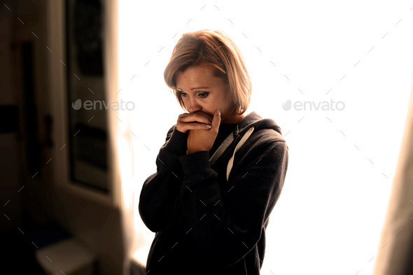 attractive woman suffering depression and stress crying alone in pain (Misc) Photo Download