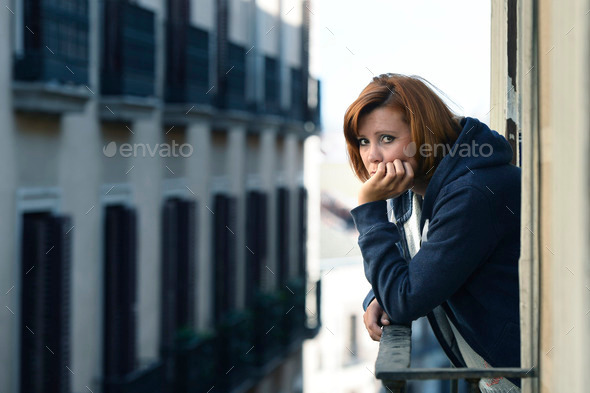 attractive woman suffering depression and stress outdoors at the balcony (Misc) Photo Download