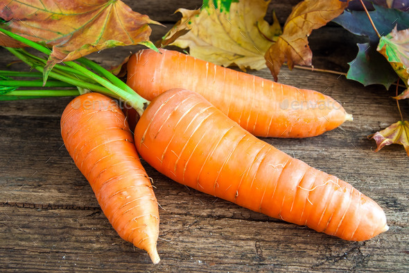 carrots on a wooden background (Misc) Photo Download