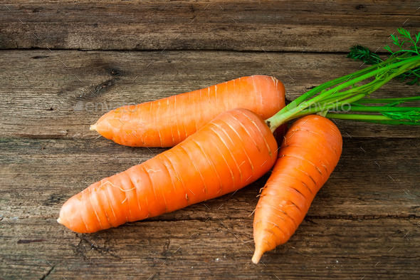 carrots on a wooden background (Misc) Photo Download