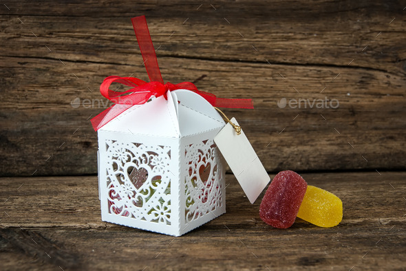 gift box with chocolates on a wooden background (Misc) Photo Download