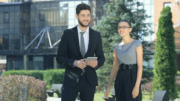 Successful Business Partners Are Working On A Tabl Successful Business Partners Are Working On A Tabl