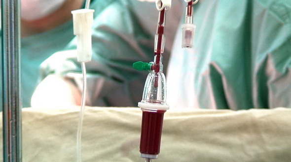 Blood Drip in Operation Room with Surgeons Blood Drip in Operation Room with Surgeons