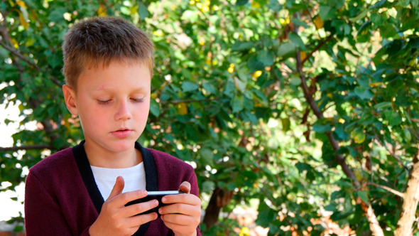Young Man Communicates On The Smartphone Young Man Communicates On The Smartphone