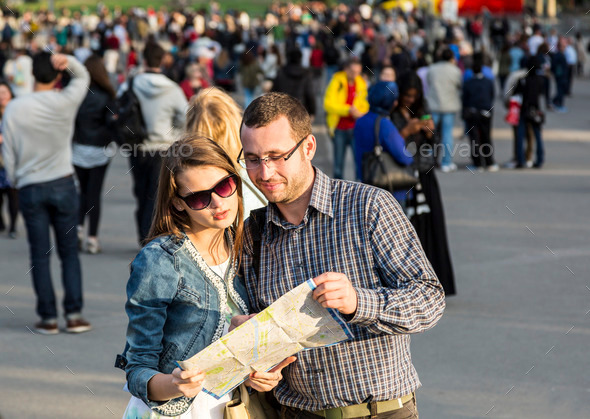Couple with a Map in a Crowded City (Misc) Photo Download